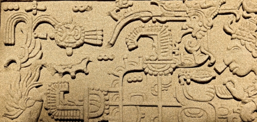 Aztec inspired sand-art bass relief